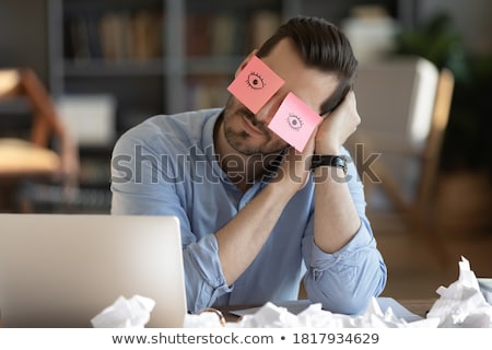 [[stock_photo]]: Tired Businessman Having A Nap On The Desk