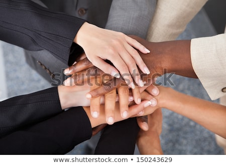 ストックフォト: Group Of Businesspeople Stacking Hands