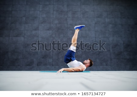 ストックフォト: Fitness And Sport Man Doing Candlestick Exercise