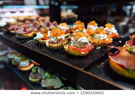 Stockfoto: A Wide Variety Of Traditional Tapas With Seafood In Spain At The San Miguel Market