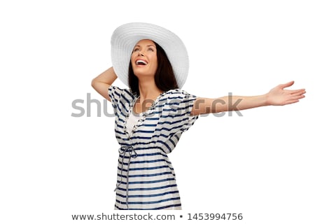 Foto stock: Young Woman In Striped Tunic And Sun Hat