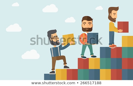 Foto stock: Man Carrying Pile Of Bricks