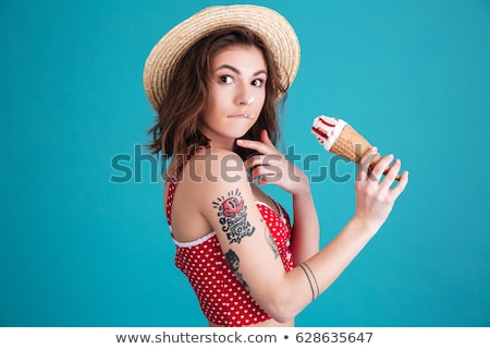 Foto stock: Delighted Young Girl In Summer Hat And Swimwear