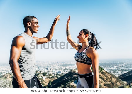 Foto stock: Woman Training With Personal Trainer Outdoor