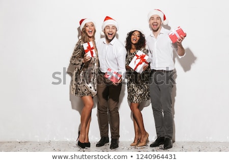 Zdjęcia stock: Group Of Happy Friends Dressed In Red Hats