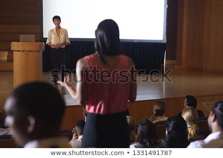 Stockfoto: Front View Of Beautiful Asian Businesswoman Discussing While Woman From The Audience Standing And As