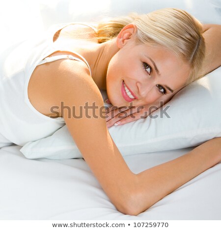 Stockfoto: Beautiful Blonde Girl In Bed Smiling Cheerfully