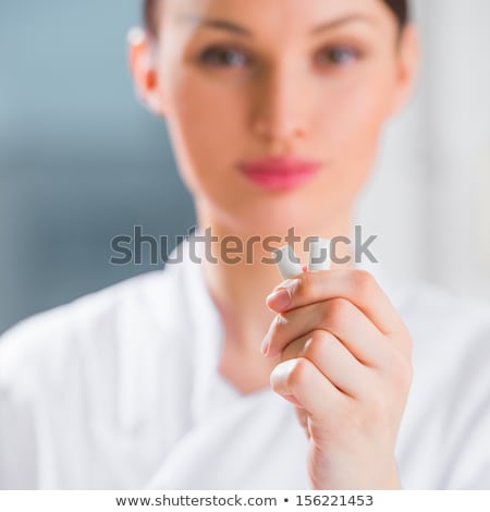 Zdjęcia stock: Young Female Dentist Doctor Holding Chewing Gum And Smiling Ora