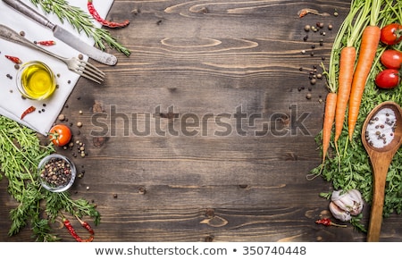 Foto d'archivio: Wooden Spoon And Fresh Organic Vegetables On Old Background