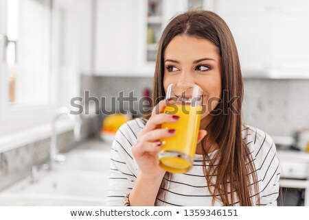 Foto stock: Woman In Shirt With Orange Juice