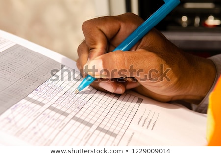 Stockfoto: Female Technican Writing On Clipboard