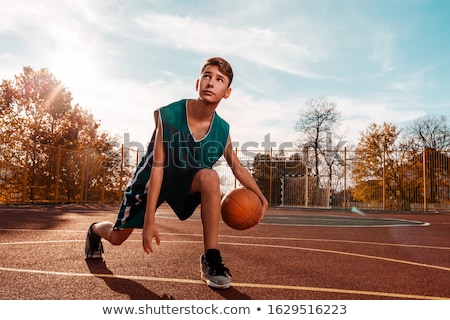 Stock photo: A Young Boy Playing In A Playground