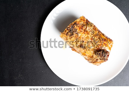 Stockfoto: White Plate With Gourmet Snack And A Piece Of Meat