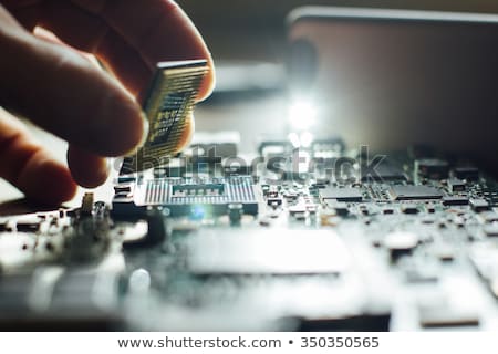 Stock foto: Engineer Or Technician Repair Electronic Circuit Board With Soldering Iron