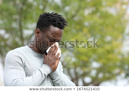 Foto stock: Sick Man Blowing Nose