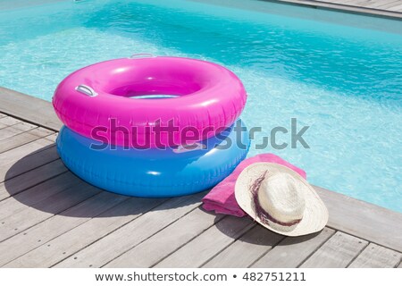 商業照片: Towels And Life Buoy Near The Swim Pool