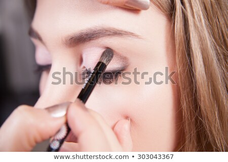 Stockfoto: Beautician Applying Eye Makeup