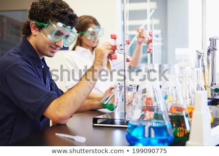 Stock fotó: Two Chemistry Students Carrying Out Experiments In A Lab