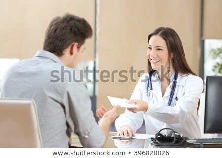 Stock foto: Lady Doctor Giving A Prescription To Her Female Patient