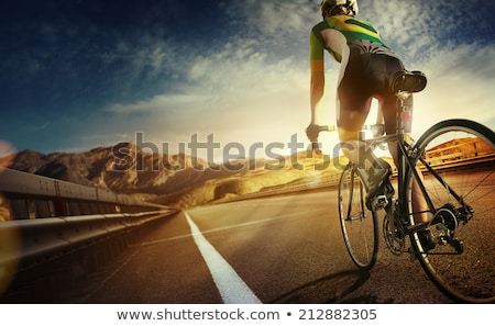 Stock photo: Woman Cyclist Riding A Bike On A Mountain Road