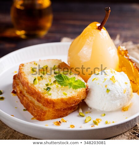 Stockfoto: Brioche Cake With Poached In Wine Pear Caramel Croquant And Fresh Ricotta Cream In A White Plate O