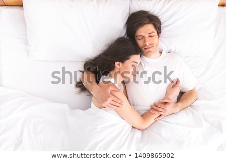 Сток-фото: Romantic Couple Sleeping In A White Bed