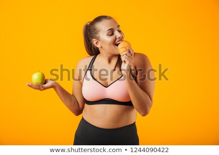 Zdjęcia stock: Image Of Adorable Chubby Woman In Tracksuit Holding Apple And Ea