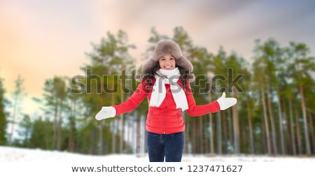 Foto d'archivio: Woman In Fur Hat With Snow Over Winter Forest