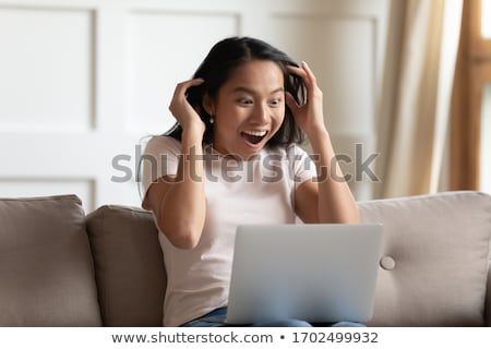 ストックフォト: Astonished Woman Gawping At A Laptop