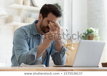 [[stock_photo]]: Stressed Man With Migraine And Headache