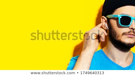 Stockfoto: Young Man With Sunglasses And Headphones Touch Glasses