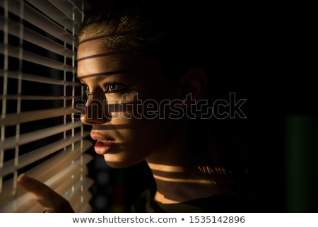 Stockfoto: Woman Behind Blind