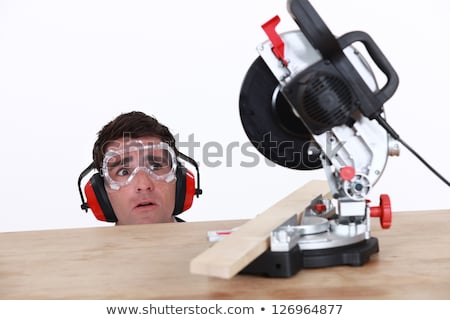 Stock fotó: A Carpenter Afraid Of His Circular Saw