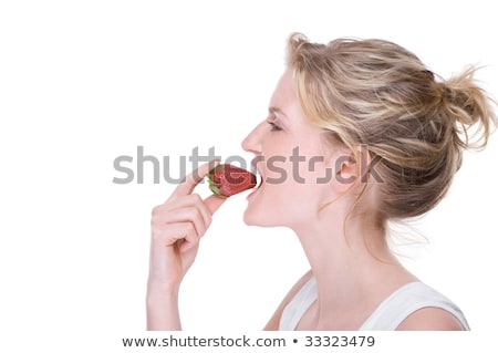 Foto stock: Young Woman Biting Strawberry Isolated On White