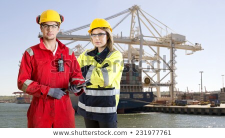 Zdjęcia stock: Dockers Posing In Front Of A Container Ship