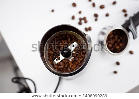 ストックフォト: Coffee Grinder With Grains On A Black Background