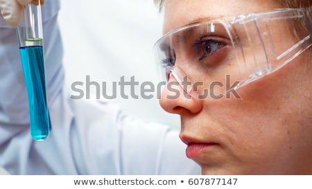 Foto stock: Close Up Of Scientist Face In Chemical Lab
