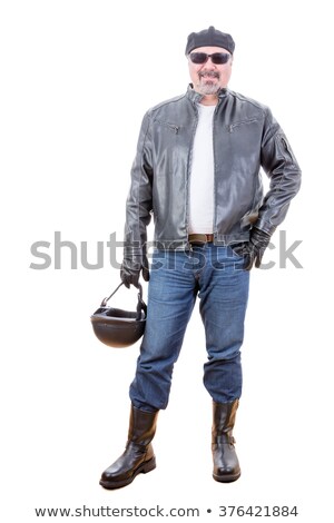 Stock foto: Tough Smiling Motorcyclist Standing Over White