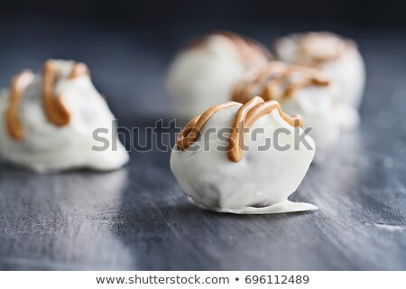 Stockfoto: White Chocolate Truffle Candy Drizzled With Peanut Butter