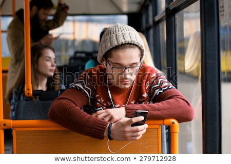 Stock fotó: Passenger Transport People In The Bus Man Rides A Bus Listeni