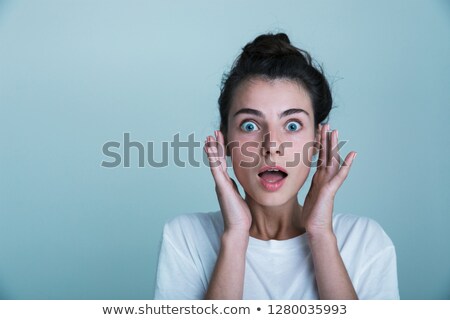 Stock fotó: Close Up Of A Shocked Young Woman Wearing Tank Shirt