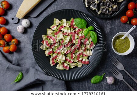 Foto d'archivio: Portion Of Farfalle With Pesto With Ingredients