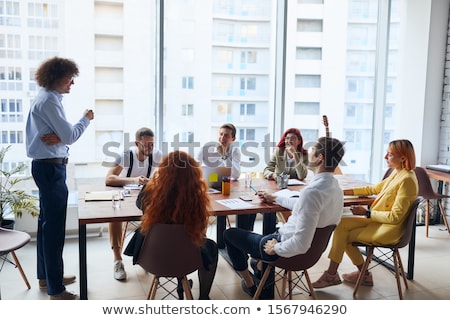 Stock photo: Portrait Of Young Business Woman Wearing Formal Clothes Giving C