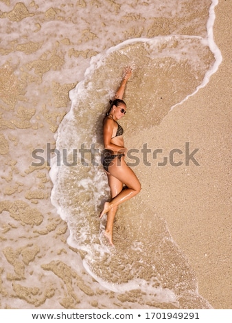 Woman Laying On The Sand Stockfoto © MilanMarkovic78