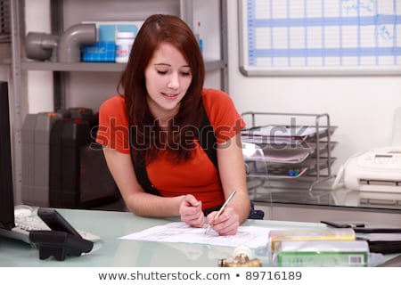 Foto stock: Young Woman Working In The Office Of A Plumbing Firm