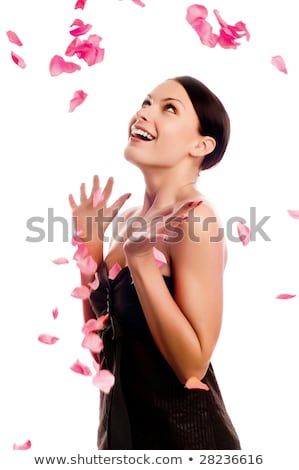 Foto d'archivio: Brunette And Flowers Petals In A Spa