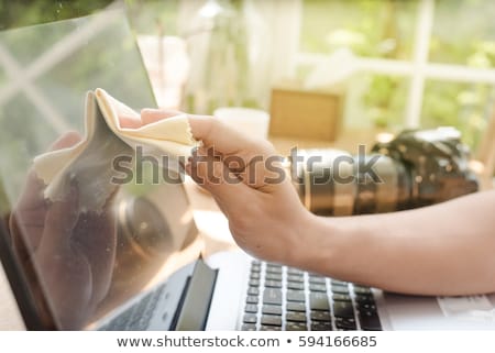 Stock photo: Close Up Of Woman Hand Cleaning Laptop Screen