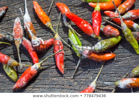 Foto stock: Shrinking And Mouldy Chili Peppers