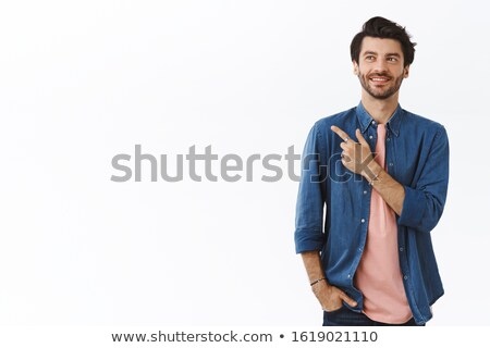 [[stock_photo]]: Stylish Bearded Businessman With Hand In Pocket Pointing At Camera With Finger