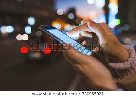Stock foto: Teenage Girls Playing With Mobile Phones